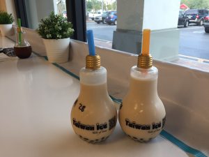 Two jasmine milk teas with boba in lightbulb bottles give a creative look to the desserts at Taiwan Ice. Photo by Christy Ma
