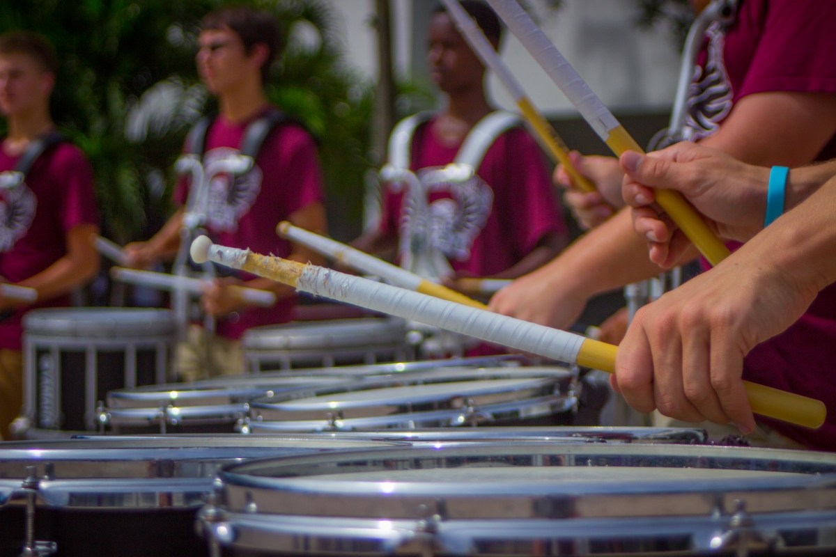 (Photo Gallery) Drum line and color guard give pre-game performance to boost spirit