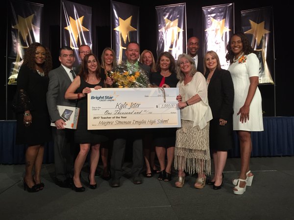 Jeter accepts cash prize of $1,000, the monetary award for being named Broward County Teacher of the Year. 