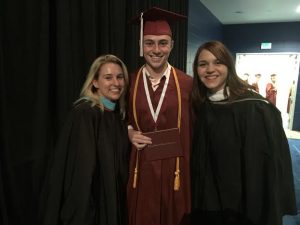 Senior Zack Kaufman poses with two of his former teachers before the ceremony begins.