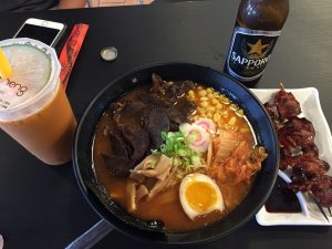 From left to right there is the large Thai boba tea, spicy kimchi beef ramen and octopus skewers that I had for lunch. Photo by Christy Ma