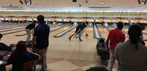 Senior Scott Hafetz looks on as the bowling ball approaches the pins. Photo courtesy of Richard Doan