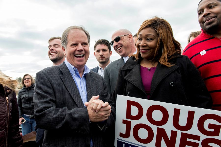 Doug Jones, Democratic candidate for the U.S. Senate seat in Alabama, greets supporters outside the Bethel Baptist Church on election day, Tuesday, Dec. 12, 2017. (Brian Cahn/Zuma Press/TNS)