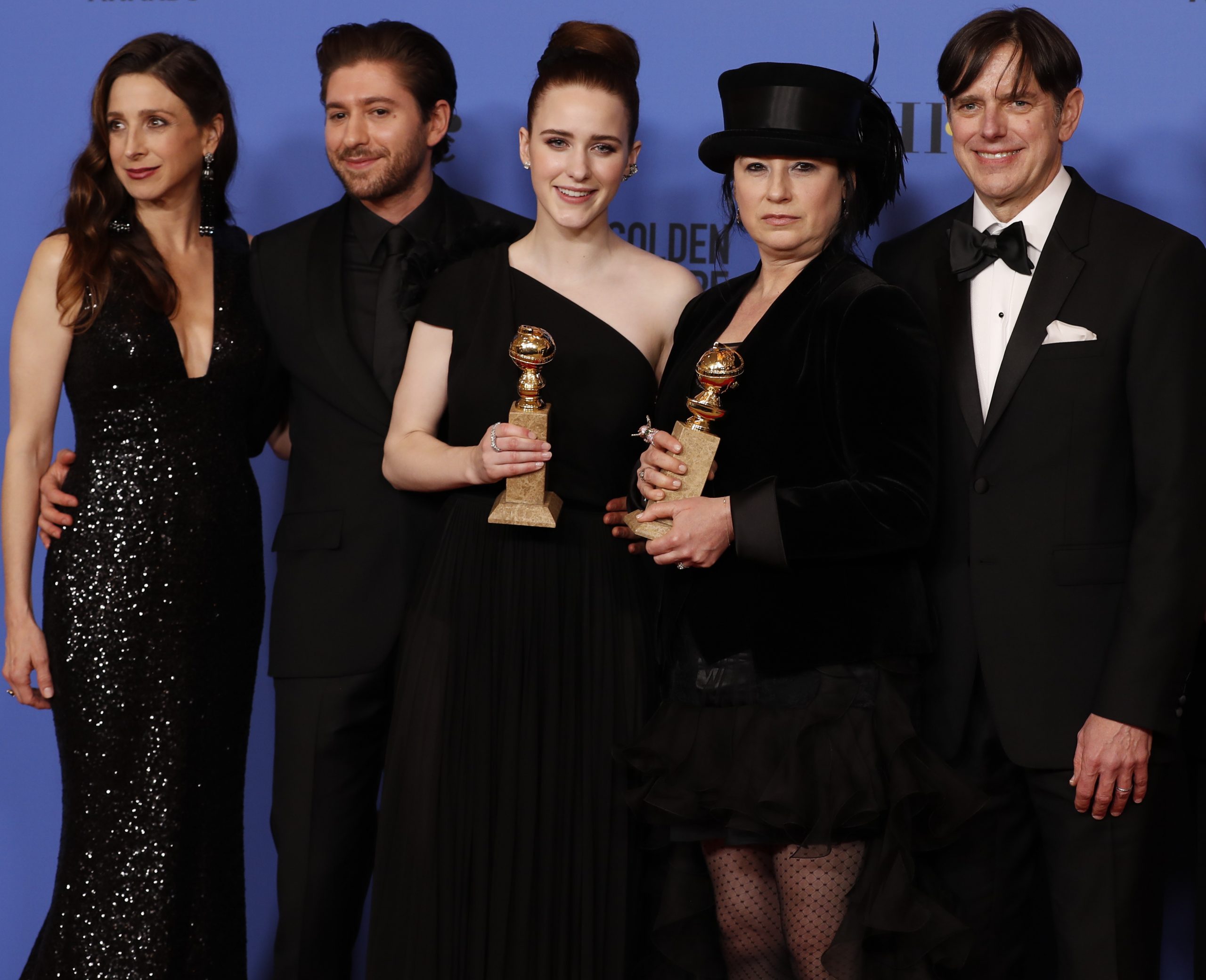 From left, Marin Hinkle, Michael Zegen, Rachel Brosnahan, Amy Sherman-Palladino, Daniel Palladino, and Tony Shalhoub backstage at the 75th Annual Golden Globes at the Beverly Hilton Hotel in Beverly Hills, Calif., on Sunday, Jan. 7, 2018. (Allen J. Schaben/Los Angeles Times/TNS)
