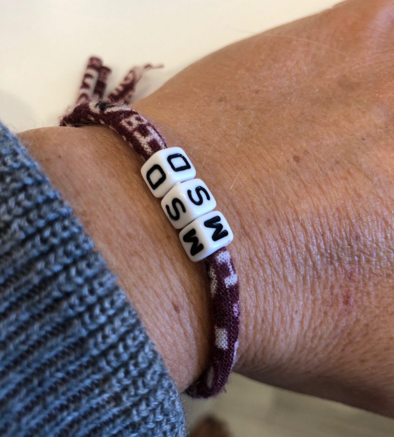 Mother of an MSD student wears a Three Heart Strings bracelet. Courtesy of Gale Block