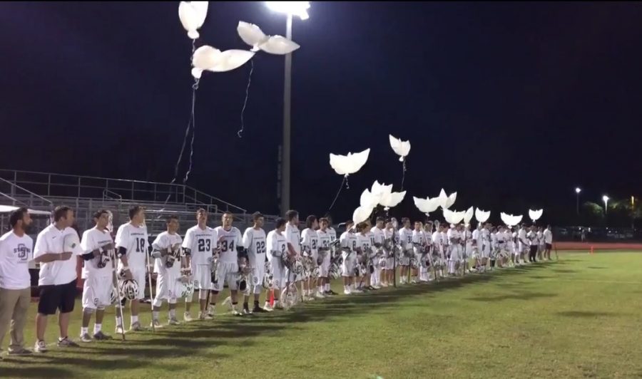 MSD mens lacrosse team releases angel-shaped balloons into the sky before their game. Courtesy of Ryan Burton