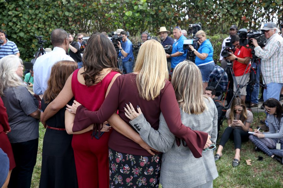 Broward County School Board members stand together as they talk with the media on Feb. 23, 2018 in Parkland, Fla. Teachers and school administrators returned to Marjory Stoneman Douglas High School for the first time after 17 victims were killed in a mass shooting at the school. (Mike Stocker/South Florida Sun Sentinel/TNS)