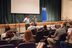 Juan speaks to the potential candidates about the importance of party support in elections. 