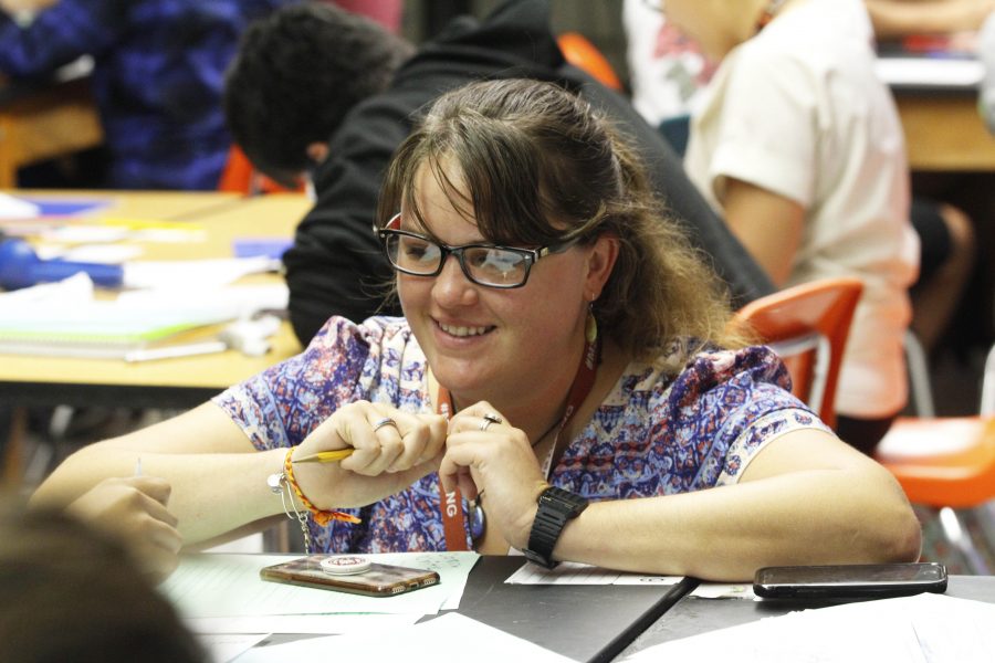 Marine Biology teacher Caitlin Hanley helps a student.