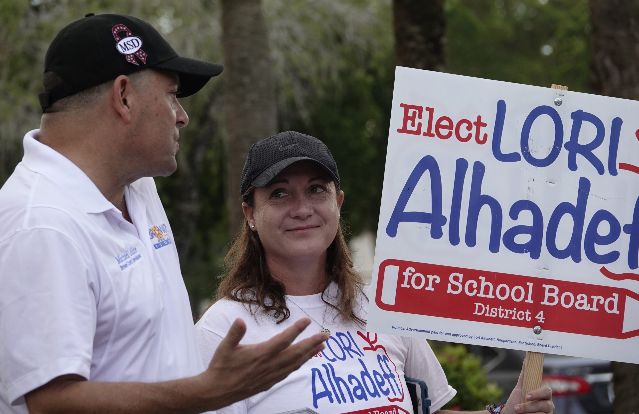 Lori Alhadeff speaks County Commissioner Michael Udine at a polling place in Tamarac, Fla., Tuesday, Aug. 28, 2018. Alhadeff has become a forceful advocate for gun control and school safety. (Joe Cavaretta/South Florida Sun Sentinel/TNS)