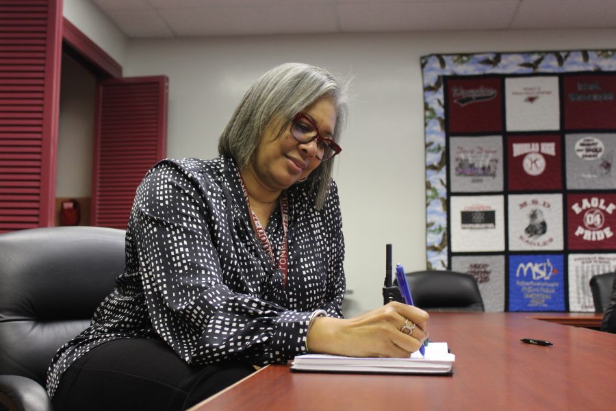 On Task. Principal on Task Assignment Teresa Hall works in the principal’s conference room in the main office. Photo by Nyan Clarke