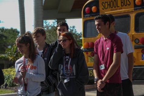 Seniors Jessica Frengut, Maddy King, Nathan Louis, Erich Cook and Michael Robb check in to vote at the Parkland Recreational Center on Thursday, Nov. 1. Eligible seniors were  transported to the polls to vote for the first time as part of a Broward County Public Schools initiative to engage young voters. Photo by Rebecca Schneid