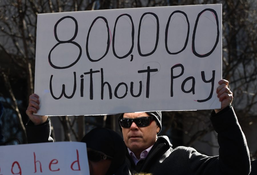 On the 20th day of a partial government shutdown, furloughed federal workers, contractors and union representatives gathered before marching to the White House to demand that President Trump reopen the government on Jan. 10, 2019 in Washington, D.C. (Olivier Douliery/Abaca Press/TNS)