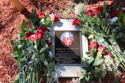 Memorial bench and tree placed in the front of the Aquatics Swimplex for Nick Dworet