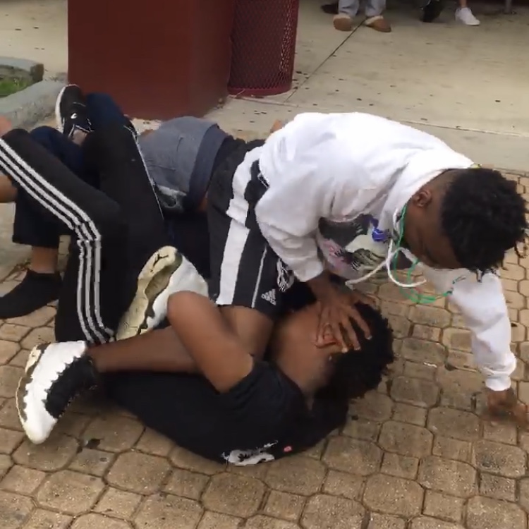 Four students arrested after lunchtime altercation.