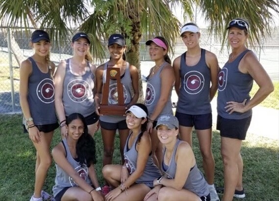 Womens varsity tennis team defeats St. Thomas Aquinas School at district tournament