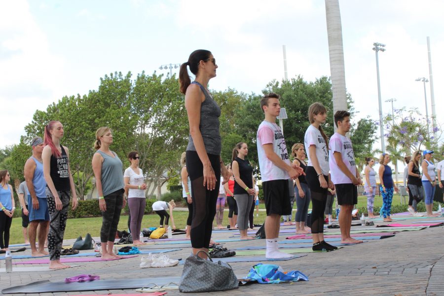 Community members particpate in Yoga 4B at the Pine Trails Park amphitheater on April 4. Photo by Samantha Goldblum