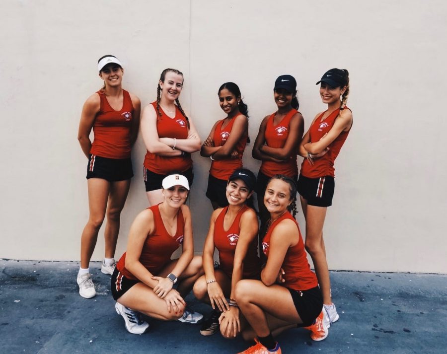 Women's varstiy tennis team celebrates after winning regional championship. Photo courtesy of Allie Schuller