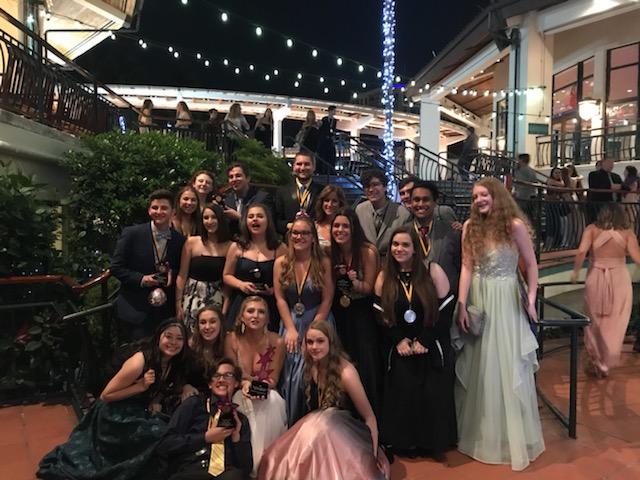 MSD drama students gather around one of their nine Cappie awards. Photo by Melody Herzfeld 