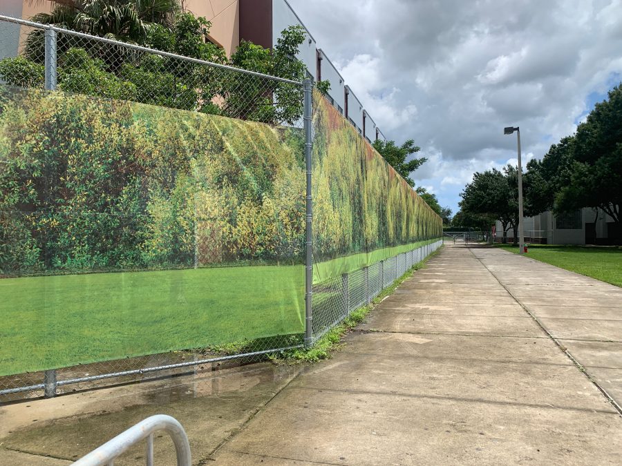 Installed in August 2019, a new banner depicting a calming forest scene surrounds the 1200 building. Following the Feb. 14, 2018 shooting at Marjory Stoneman Douglas High School that killed 17 students and staff members and injured another 17, the building has been designated a crime scene and is in the custody of the state attorneys office. The building is still being reported as usable classroom space on the Florida Inventory of School Houses report for MSD.