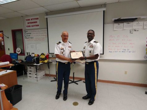 Colonel Kenneth P. Green presents Ramon Arias with the Silver Instructor Award certificate. Photo courtesy of Anna Koltunova