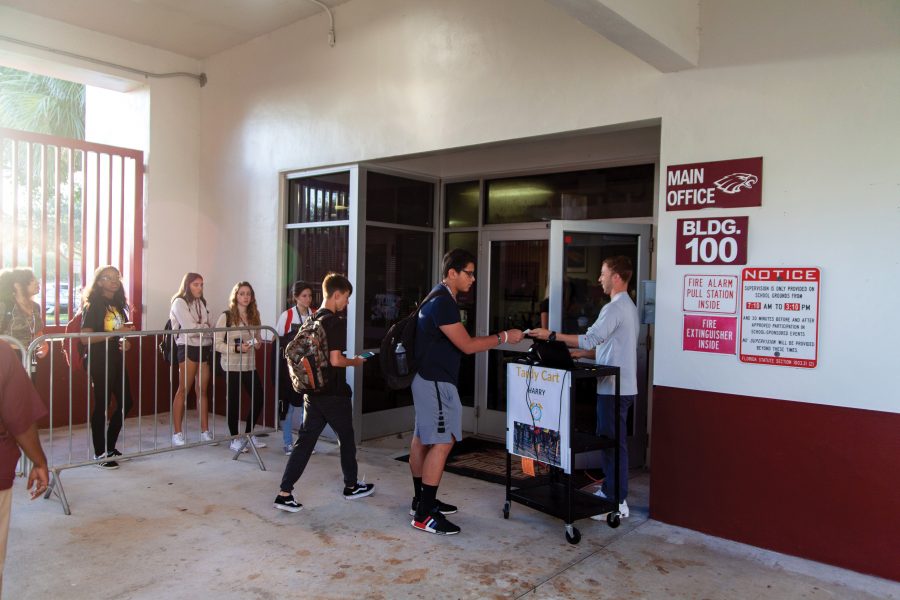 Fashionably Late. Students come late to school and have to line up to get tardy passes before heading to class in the morning. The new tardy policy requires students to get a pass to class, if they are not in class by 7:40 a.m. Photo by Darian Williams