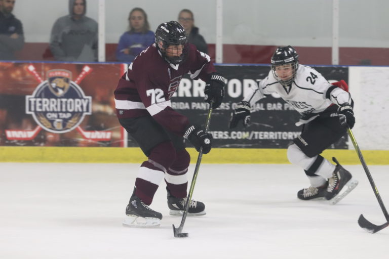 Forward John Brace (72) takes the puck up the ice, aiming to mount a lead. Photo by Jenna Harris