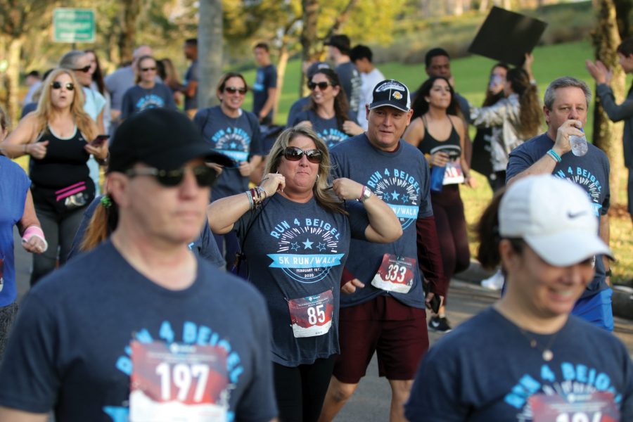 Math teacher Cindi Helverson honors the life of former MSD social studies teacher Scott Beigel at the third annual Run 4 Beigel 5K race on Saturday, Feb. 1. The race was held at Pine Trails Park in Parkland, Florida. Photo by Darian Williams