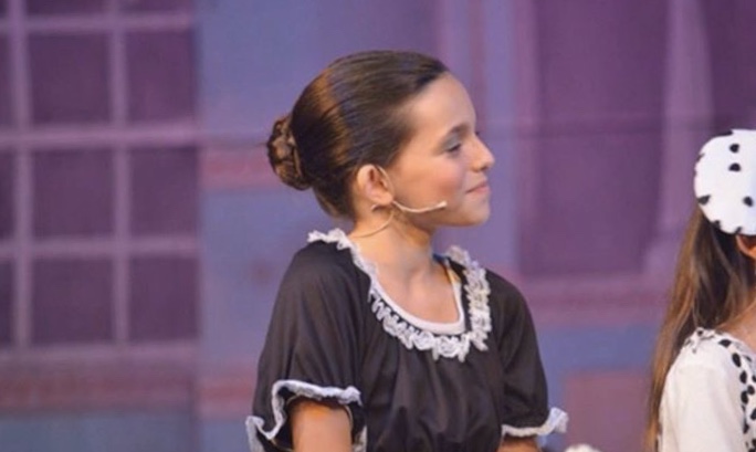 Young Harris performing in 101 Dalmatians, one of her first stage adaptations.
