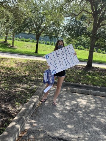 MSD sophomore Raegan DiRenzo decorated a sign to celebrate the DECA seniors. Photo courtesy of Katelyn Taylor