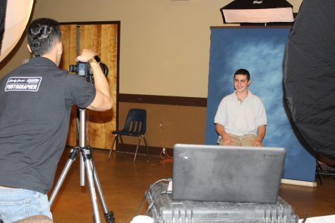 Sloan Henslovitz, freshman, poses for their yearbook photo being taken by (photographer name), Strawbridge photographer