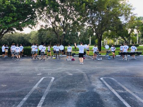 The percussion section of the band all stand six feet apart and play their tunes for cars driving by. Photo courtesy of Nick Hernandez