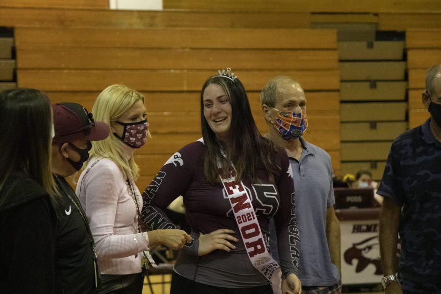 Senior Megan Pittman (25) being announced with both her parents and principal Michelle Kefford beside her. Photo by Kelsie Yon