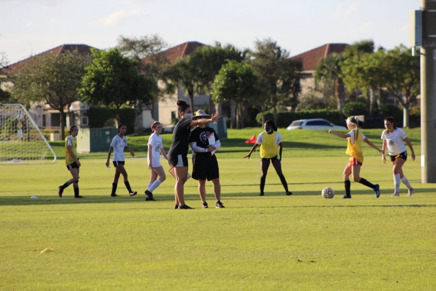  Shaping the Squad. Girls soccer coaches Laura Rountree and Mackenzie Malone evaluate players during tryouts.These tryouts led to the construction of the soccer team for the 2020-2021 season. Photo by: Theron Piccininni