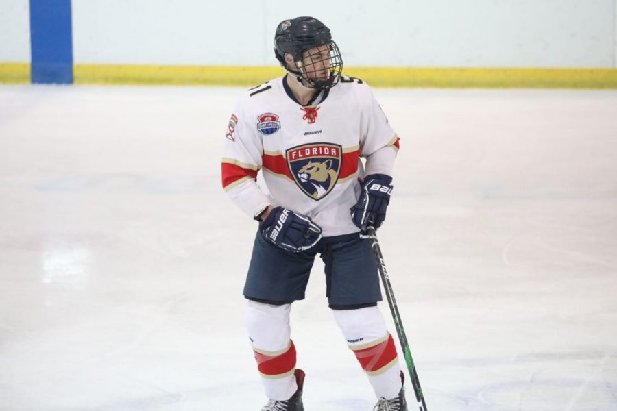 Photo of Adam Hauptman on the ice playing hockey for his previous travel hockey team, the Junior Panthers. Photo provided by Adam Hauptman