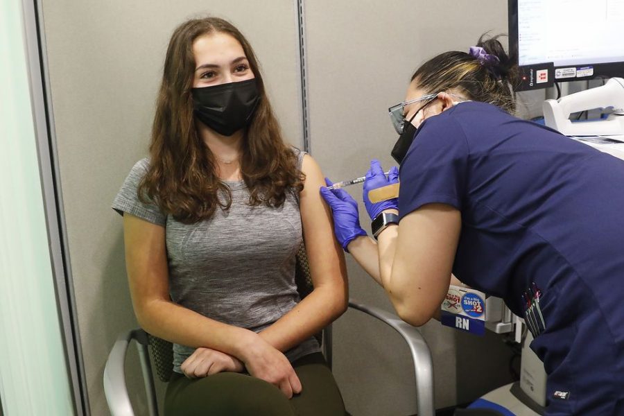 Lily Weiss, 15, of Harrington Park, gets her shot. Teenagers get the Pfizer Covid-19 vaccine at Hackensack University Medical Center Thursday after CDC cleared it for 12-15 year-olds.  Thursday, May 13, 2021. Hackensack, N.J. Photo courtesy of Aristide Economopoulos | NJ Adva
