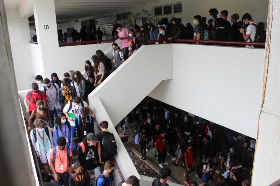 Students+pack+the+stairwell+in+front+of+the+media+center+and+cafeteria+as+they+make+their+way+to+class.+Marjory+Stoneman+Douglas+High+School+has+at+least+3%2C650+students+enrolled+for+the+2020-2021+school+year.