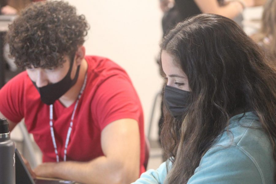 Seniors Ethan Cruz and Hayli Siegel work attentively to complete their group assignment in the English dual enrollment class offered on the school campus. Many students looking to receive college credit take dual enrollment classes at Broward College, at the University of Florida and at Marjory Stoneman Douglas High School.