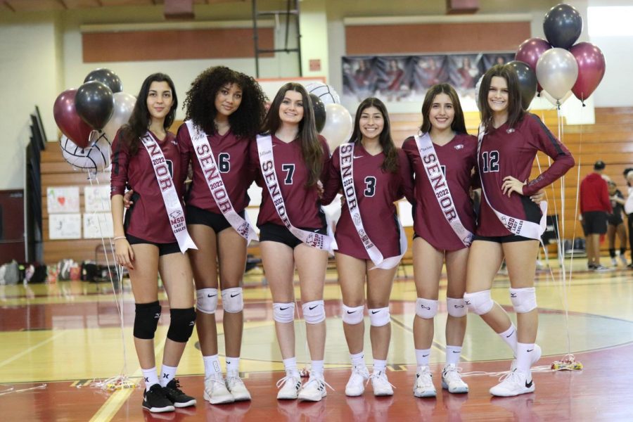 The seniors of the MSD womens varsity volleyball team take a photo together before their senior night game. The event commemorates their years of service to the volleyball team.