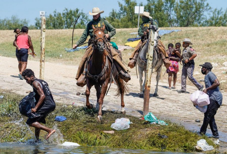 United States Border Patrol agents on horseback try to stop Haitian migrants from entering an encampment on the banks of the Rio Grande near the Acuna Del Rio International Bridge in Del Rio, Texas on September 19, 2021.