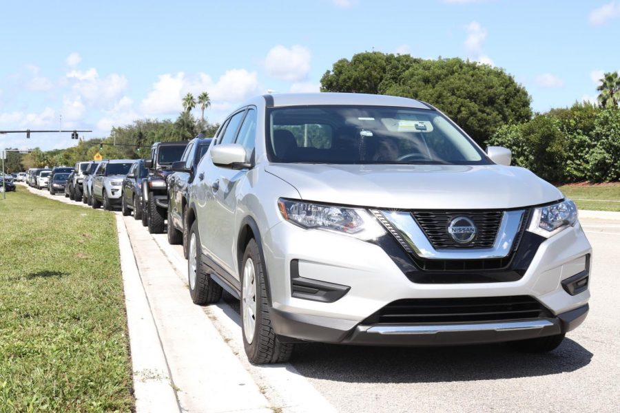 Traffic Turmoil. The after-school line of cars out of the carline stretches around the Pine Island-Holmberg intersection daily.