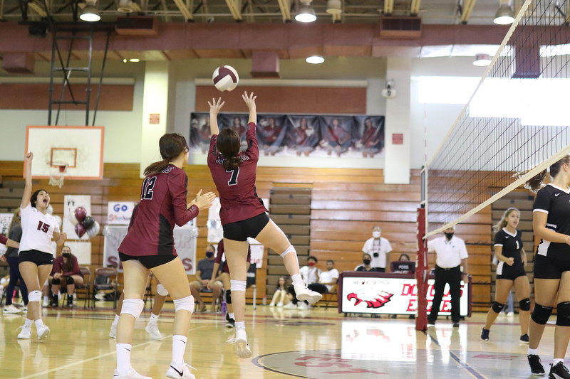 Captain Jillian Carroll  (7) bumps the ball onto the other side of the net. Carroll went on to score a point in the game.