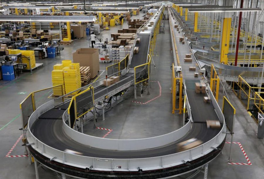 Packages passed down a conveyor bound for delivery trucks at Amazon's Shakopee, Minn., fulfillment center. (Anthony Souffle/Minneapolis Star Tribune/TNS)