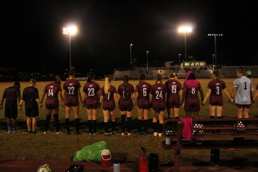 The Marjory Stoneman Douglas womens varsity soccer team gathers in preparation for a match against Cypress Bay. The team won the game and went on to face Pembroke Pines Charter in a competitive match.