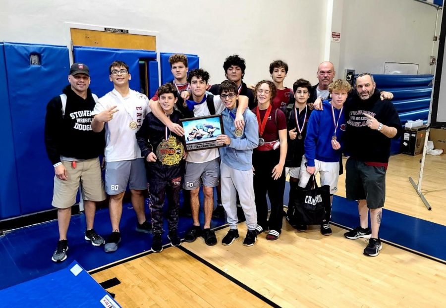 The MSD wrestling team poses with their first place award they received at their first tournament of the 2021-2022 season. Three of the teams wrestlers contributed towards the victory by winning their respective brackets. Photo courtesy of MSD Wrestling