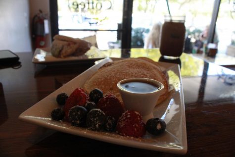 Get cozy at the Little Coffee Shop and try the freshly made Lemon Ricotta Pancakes with Venezuelan Arepas.