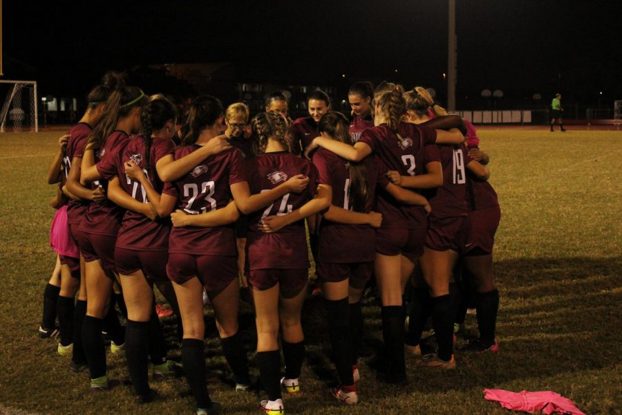 The Marjory Stoneman Douglas womens varsity soccer team gathers in preparation for a match against Cypress Bay. The team won the game and went on to face Pembroke Pines Charter in a competitive match.