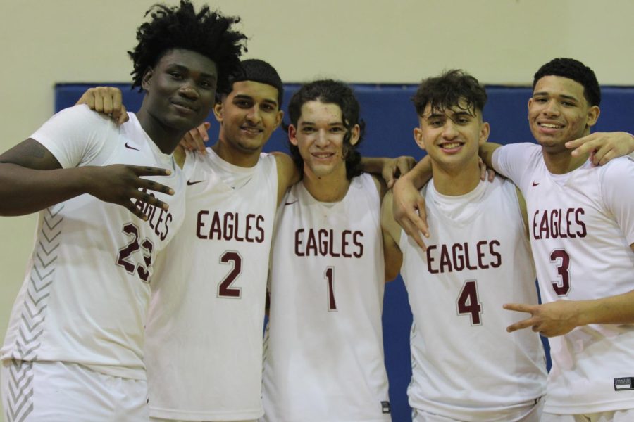 The+MSD+varsity+basketball+seniors+pose+for+a+photo+all+together+at+their+senior+night+game+against+Coconut+Creek+High+School.+The+Eagles+defeated+their+opponents+with+a+score+of+72-34.+