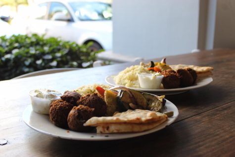 Customers can enjoy a falafel plate at Hellenic Republic, a restaurant with live music from 12-4 p.m. every weekend.