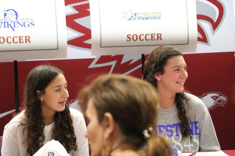Four+MSD+players+from+the+womens+varsity+soccer+team+officially+committed+to+a+college+at+the+signing+in+the+school+library+on+Feb.+2.